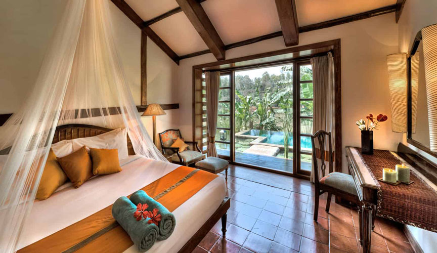 evolve-back-coorg-lilly-pool-bungalow-bedroom-500×500
